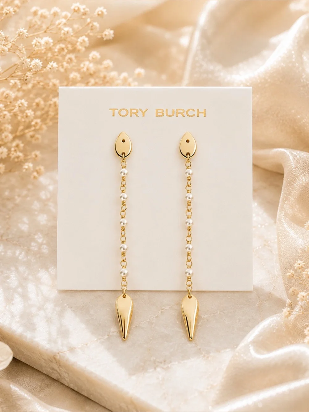 Tory Burch Snake Linear earring.